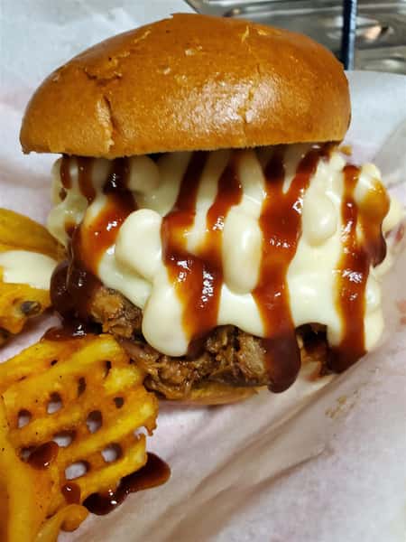 pulled pork burger with barbeque sauce and melted cheese