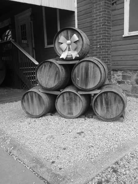 vintage photo of multiple wine barrels stacked together