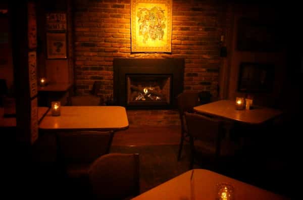interior dining area next to a fireplace