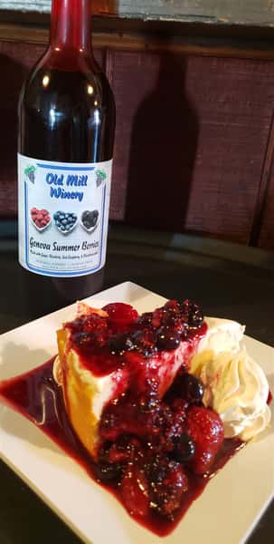 summer berry wine with cheesecake slice
