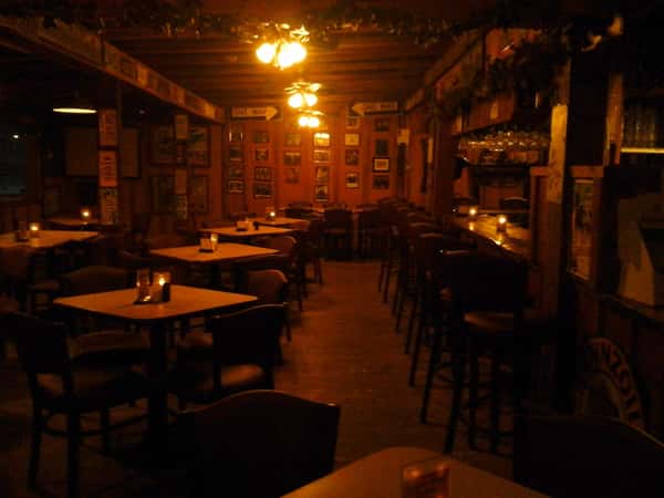 interior dining area with tables, chairs and candles