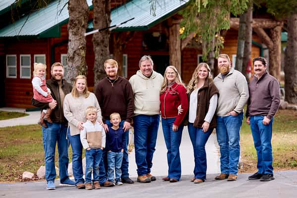 Family standing in front of their restaurant