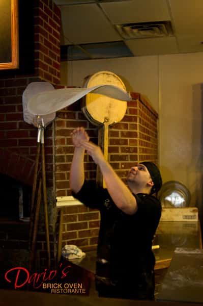 tossing the pizza dough