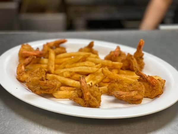A plate of golden fried shrimp served with crispy French fries at Texas Borders Bar & Grill.