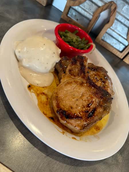 Grilled pork chops with mashed potatoes and green beans