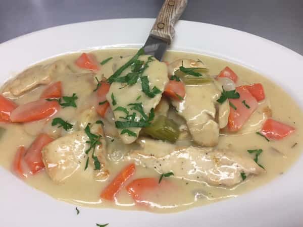 chicken, carrots, and celery in a cream sauce