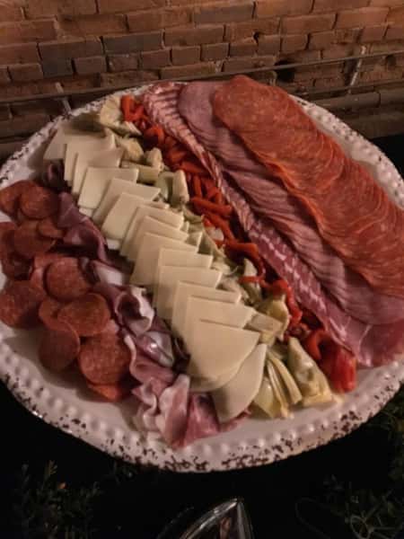a plate with a variety of cheeses and meats