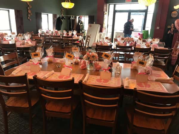 private dining tables with flower center pieces and goodie bags for each guest