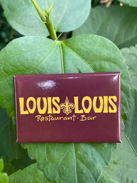 A rectangular magnet featuring the "LOUIS LOUIS" logo, with the text "Restaurant. Bar" underneath, set against a maroon background.