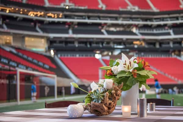 Floral arrangement on a table inside a stadium