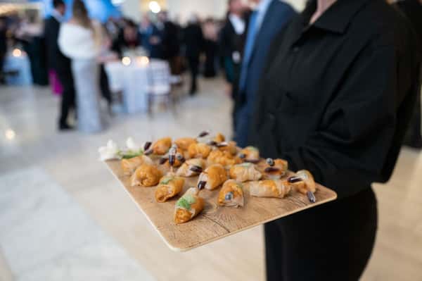 Server holding a platter of food