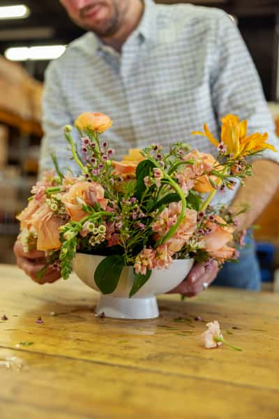 Flower designer putting together an arrangement