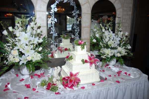 wedding cake on table with floral decor