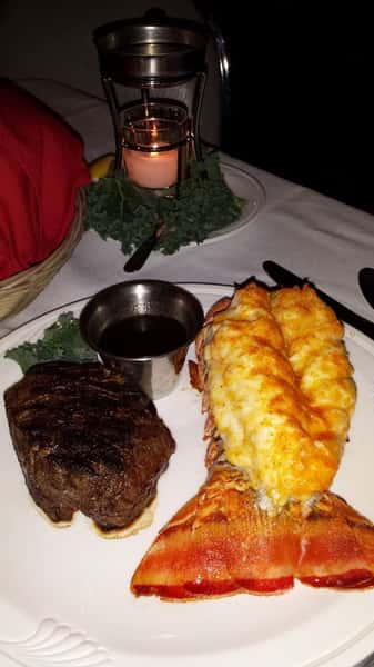 Grilled filet mignon and lobster tail on a dish