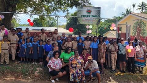Large Group photo at Jamaican community outreach event