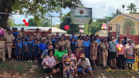 Large Group photo at Jamaican community outreach event