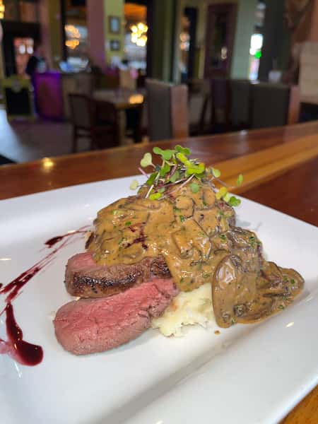 8oz sirloin of filet/ parmesan mash/ mushroom cognac cream sauce/ red wine reduction