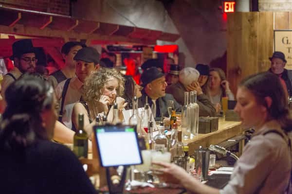 bar shot of ladies and men dressed in 1920s clothing