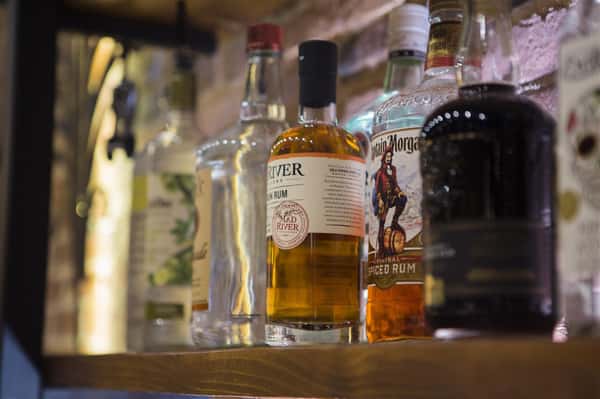 a closeup of various bottles of rum