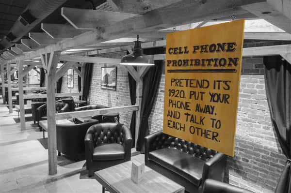 a sign discouraging cellphone use