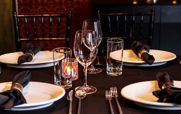 private dining, table with wine glasses, dinnerware