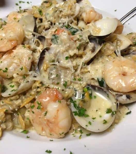 shrimp and clams in a garlic white wine sauce