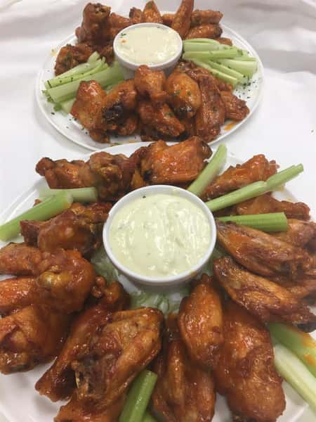 two trays of buffalo wings
