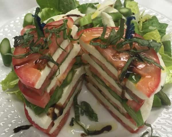 Caprese: Fresh Mozzarella, Garlic, House made Roasted Red Peppers, Tomatoes, and Drizzled with Olive Oil