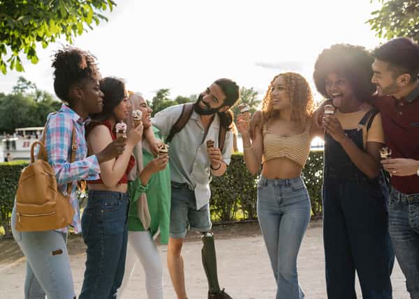 group of people eating and holding ice cream