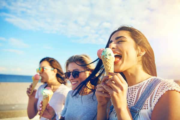 three people eating ice cream