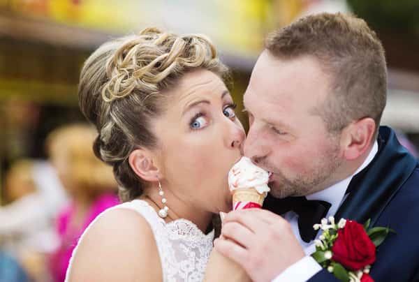 bride and groom sharing one ice cream