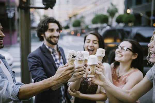 group of people each holding an ice cream