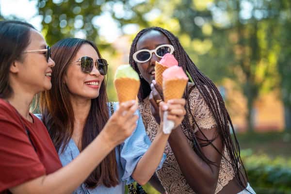 group of women holding ice creams
