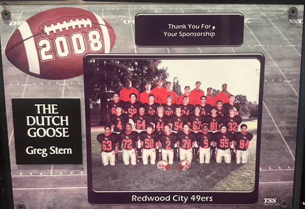 Plaque thanking sponsor The Dutch Goose with 2008 football graphic and Redwood City 49ers youth team photo honoring Greg Stern