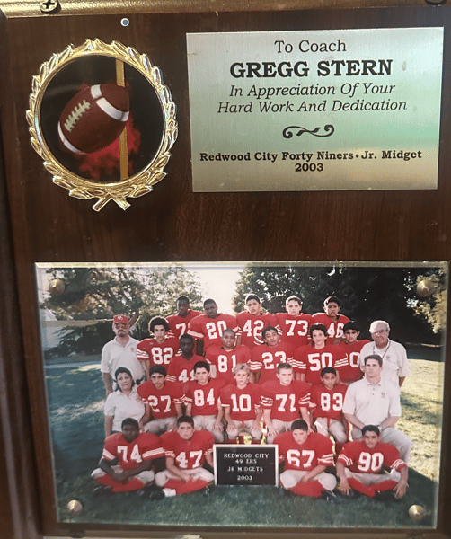 Plaque honoring Coach Gregg Stern with Redwood City 49ers Jr. Midget 2003 football team photo and appreciation inscription