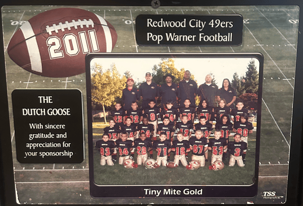 Framed 2011 Redwood City 49ers Pop Warner Tiny Mite Gold team plaque, featuring youth football photo and thanks to Dutch Goose.
