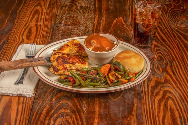 Blackened Cajun chicken with green beans, mashed potatoes, and roll at Blackwell Revival in Atkins, AR