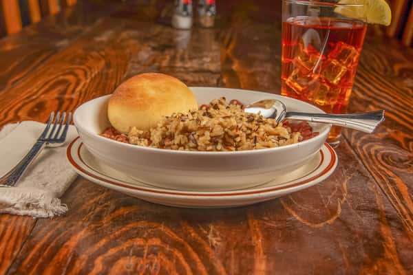 Classic Cajun red beans and rice served with a soft roll at Blackwell Revival in Atkins, Arkansas