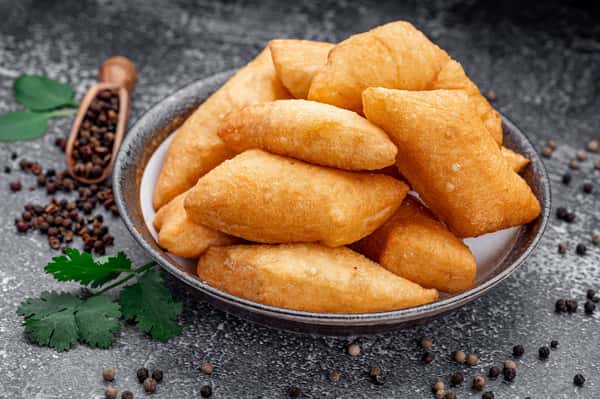Golden fried Central Asian pastries served fresh and crispy