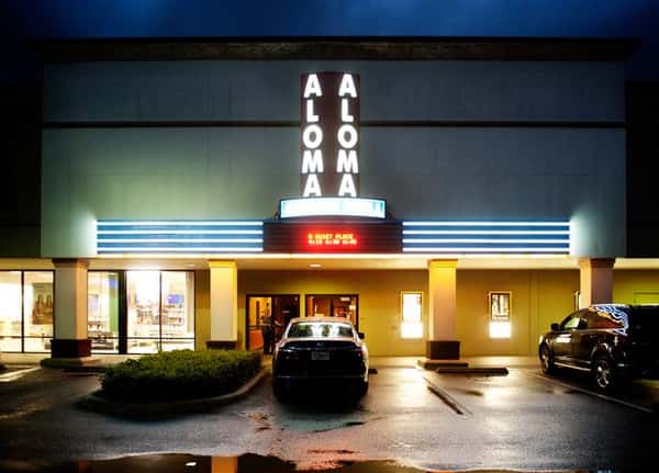 parking lot of aloma cinema grill at night