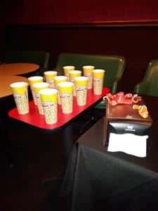 tray of tall cups for popcorn