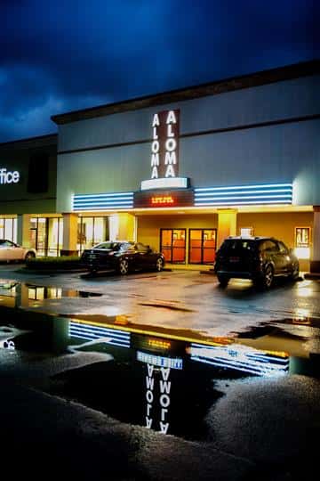 parking lot of aloma cinema grill at night