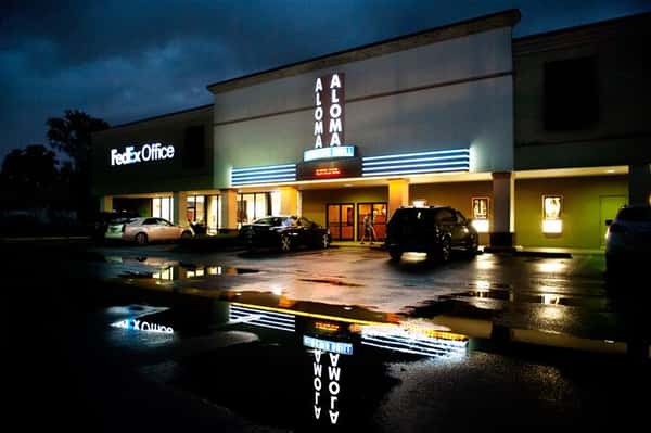 parking lot of aloma cinema grill at night