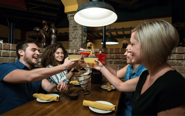 group of friends toasting with drink