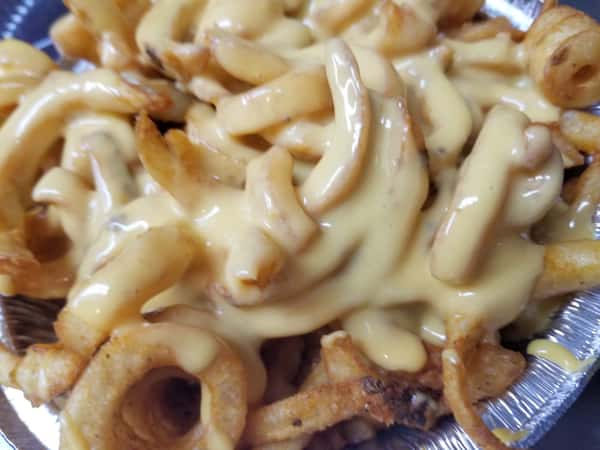 curly french fries covered in melted cheese