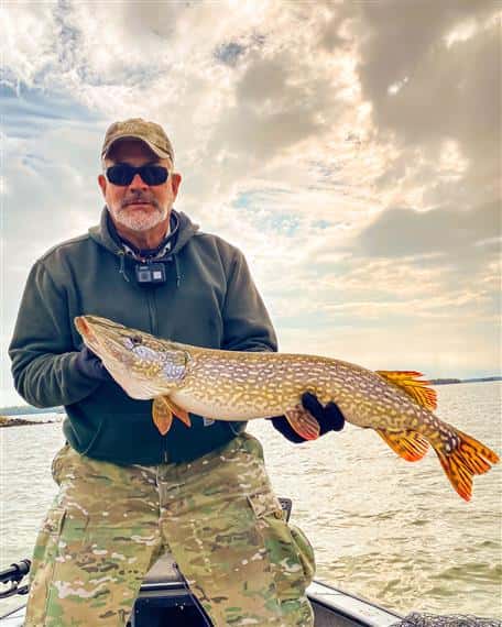fisherman holding large fish