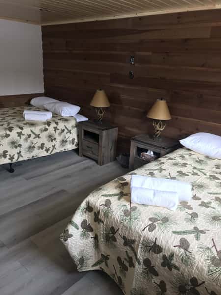 two beds in a cabin