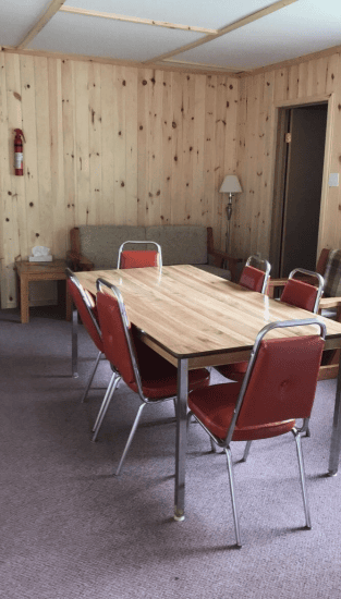indoor room with tables and chairs