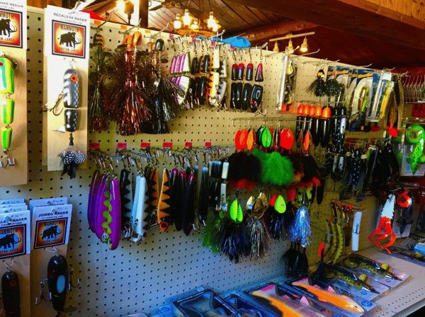 assortment of fishing gear on a wall