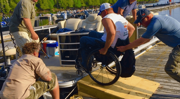 man in wheelchair on a dock